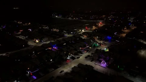 Pan Right Aerial Night View of Snow Covered Edmonton Neighborhood, Alberta Видео 336354693