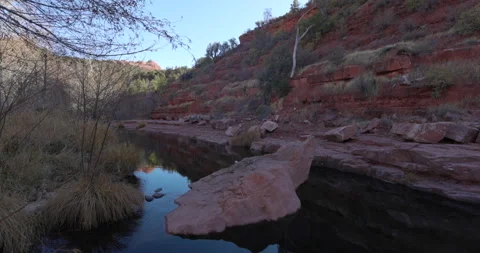 Pan Right along river cliff in Sedona Arizona Stock Footage 146663543