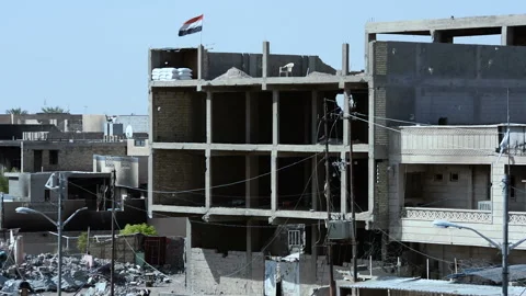 Pan right and leftt on destroyed buildings at Fallujah's center Stock Footage 149949302