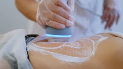 Pan Right: Anonymous Therapist Using Modern Device for Abdominal Massage 库存影片 306274204