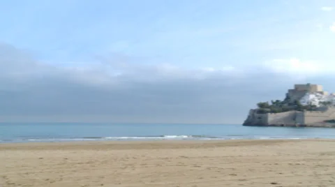 Pan right to castle by the beach Stock Footage 37243316