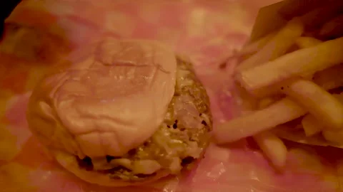 Pan Right Close up Slow Motion Burger and Fries Village Manhattan New York 4k Stock Footage 267737663