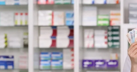 Pan Right Closeup Serious Pharmacist Woman Looking Camera Show Drugs Euro Bills Stock Footage 72796452