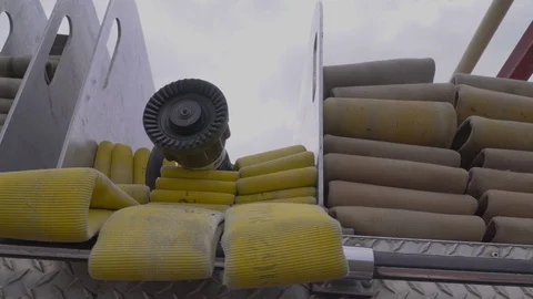 Pan right of fire engine hoses neatly stacked in place on fire engine. 5 Stock Footage 114104806