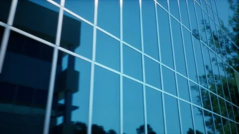 A Pan right to generic reflective bank building in mid-day Stock Footage 155221614