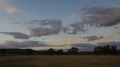 Pan right of grassy flat on prairie morning sunrise Stock Footage 75225158