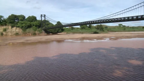 Pan right of a large bridge over a river Stock Footage 310541510