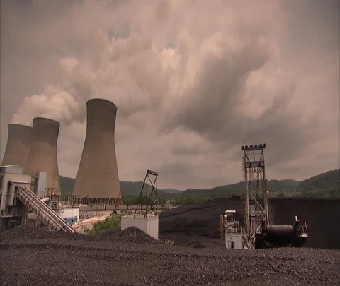 Pan right to left from cooling towers to view John E. Amos coal power plant Stock Footage 86694292