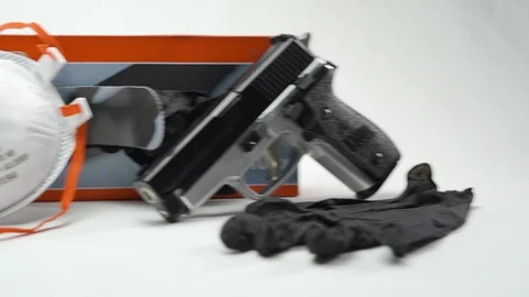 Pan From Right To Left Gun Disposable Gloves Face Mask Stock Footage 126015629