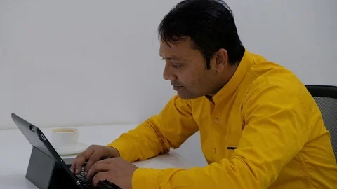 Pan right to left of sudden good news and information on email between coworkers Stock Footage 100025763