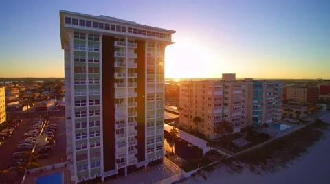 Pan right to left of sun and high rise condominium near Tampa Bay, Florida Stock Footage 61707565