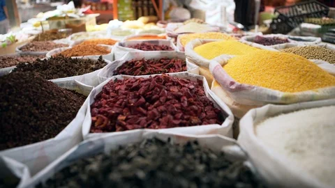Pan Right to Left: Various Grains in Sacks Found in the Market - Erlian, Stock Footage 117731288