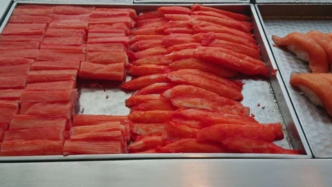 Pan right of Mixed sliced fish sushi japanese food in restaurant. Stock Footage 100678118