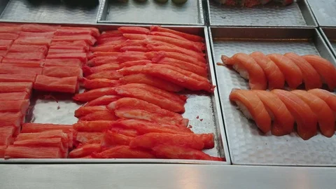 Pan right of Mixed sliced fish sushi japanese food in restaurant. Stock Footage 101470392