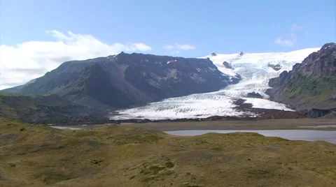 Pan right from moraines to the retreating Glacier that created them Stock Footage 37892482