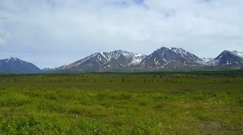Pan Right, Mountain Range with Green Field Stock Footage 37393068