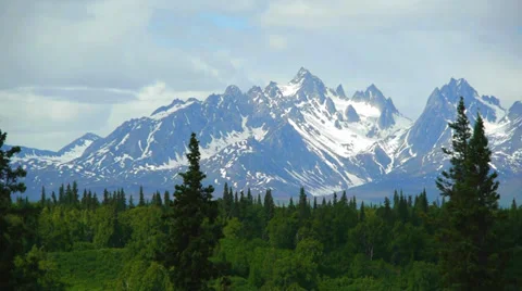 Pan Right, Mountain Range With Lush Forest Foreground Stock Footage 33529182