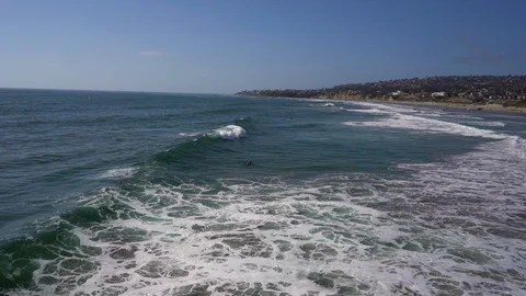 Pan Right Pacific Beach Surfer In Waves Stock Footage 96040201