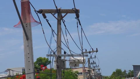 Pan right POV video from a lineman working on a utility pole showing a load. Видео 340278074