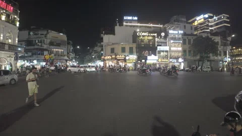 Pan right shot of traffic round-about at Old Quarters in Hanoi Stock Footage 286346511
