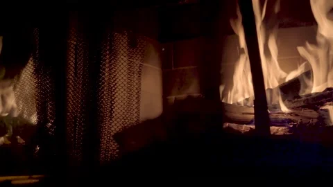 Pan right slow motion, of fire in cabin fireplace Ellijay Georgia 4k Vídeos de archivo 260743030