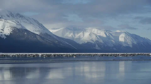Pan Right Snowy Mountains, Reflected in Water Stock Footage 38064641