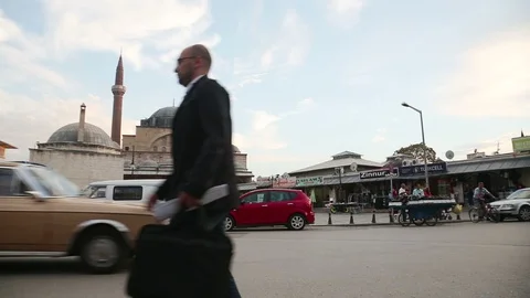 Pan right on traffic and shops near Serafettin Mosque, Konya, Turkey Stock Footage 119903307