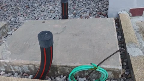 Pan right video of a concrete foundation pad for a station service. Видео 340376949