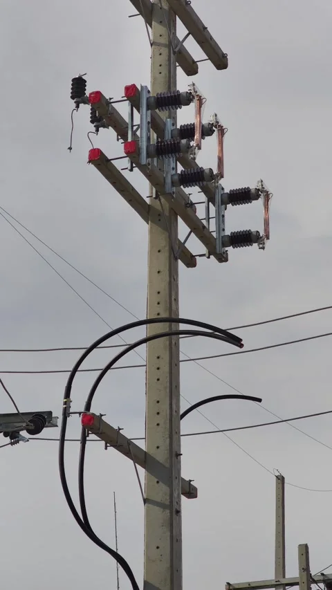 Pan right video of concrete riser pole with high voltage underground cables. Stock-Footage 338194755