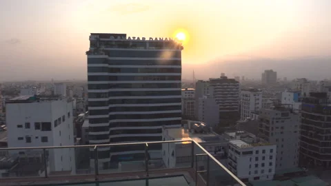 Pan right video high angle of Avatar Danang building with sun flare Vidéo 271062258