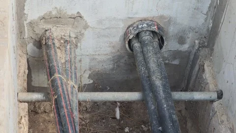Pan right video of high voltage underground cables inside a concrete trench. Видео 340376810