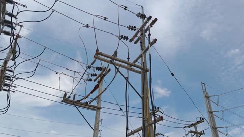 Pan right video from an incoming riser pole to a high voltage circuit. Stock Footage 345201756