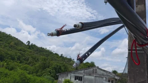 Pan right video of stripped twisted aerial cables prepared for jointing. Stock Footage 345129143