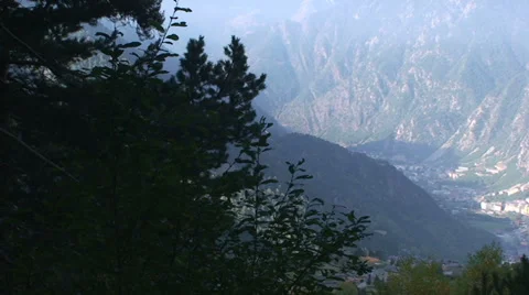 Pan to right on view over valley of Andorra la Vella from mountain Stock Footage 33405646