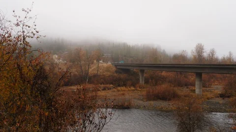 Pan river and bridge in late fall with fog.  Stock Footage 99521218