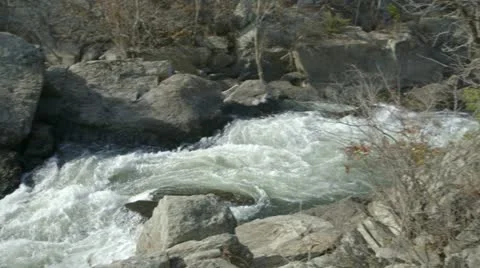 Pan from river rapids to sky Video stock 12706129