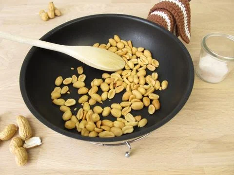 In a pan roasted peanuts with salt Stock Photos