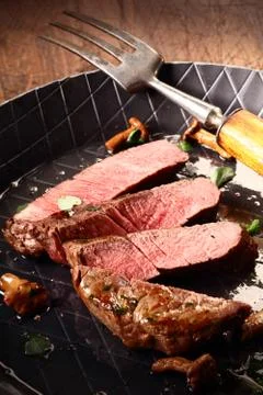 Pan roasted rare beef steak Stock Photos