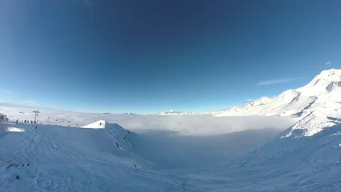 Pan from Roche de Mio (La Plagne) over Mont Blanc surrounded by a sea of clouds Stock Footage 109452988