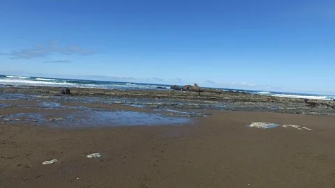 Pan of Rocks and Ocean Stock Footage 87927327