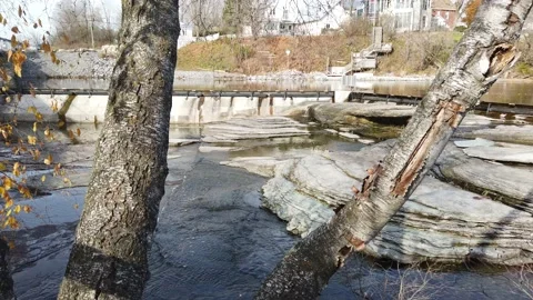 Pan of a rocky river bed with small falls Stock Footage 143196851