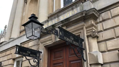 Pan from Roman Baths to Bath Abbey in the city of Bath - England Stock Footage 168761522