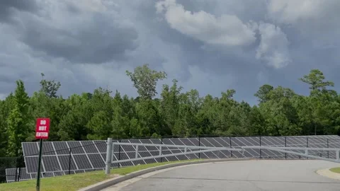 Pan of rows of solar panels behind a sec... | Stock Video | Pond5