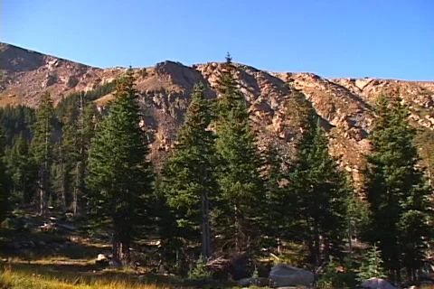 Pan RTL mountains from valley Stock Footage 266576