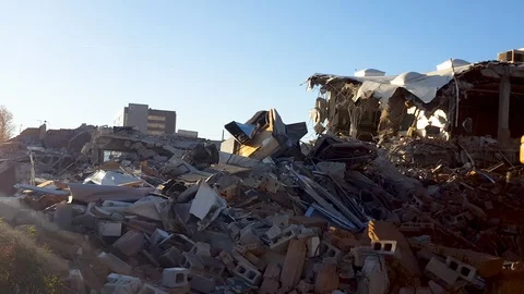 Pan-Rubble field from school building demolition Stock Footage 120265394