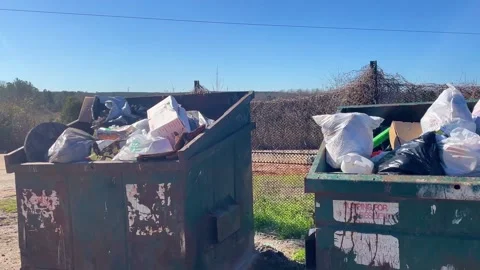 Pan of a rural county waste dump location for residents of Burke County Georg Stock Footage 147418352