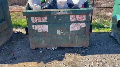 Pan of a rural county waste dump location for residents of Burke County Georg Stock Footage 147418384