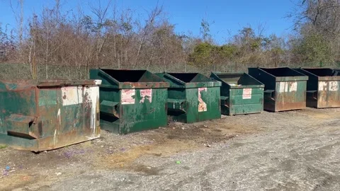 Pan of a rural county waste dump location for residents of Burke County Georg Stock Footage 147418388