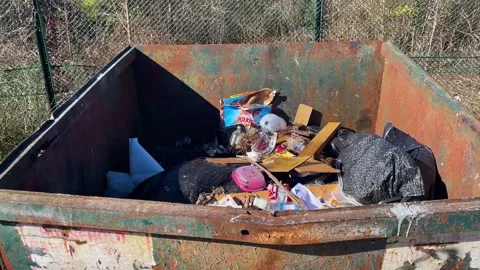 Pan of a rural county waste dump location for residents of Burke County Georg Stock Footage 147418389