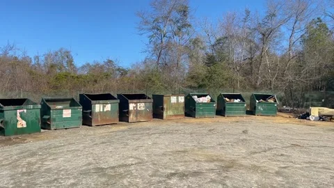 Pan of a rural county waste dump location for residents of Burke County Georg Video stock 147418392